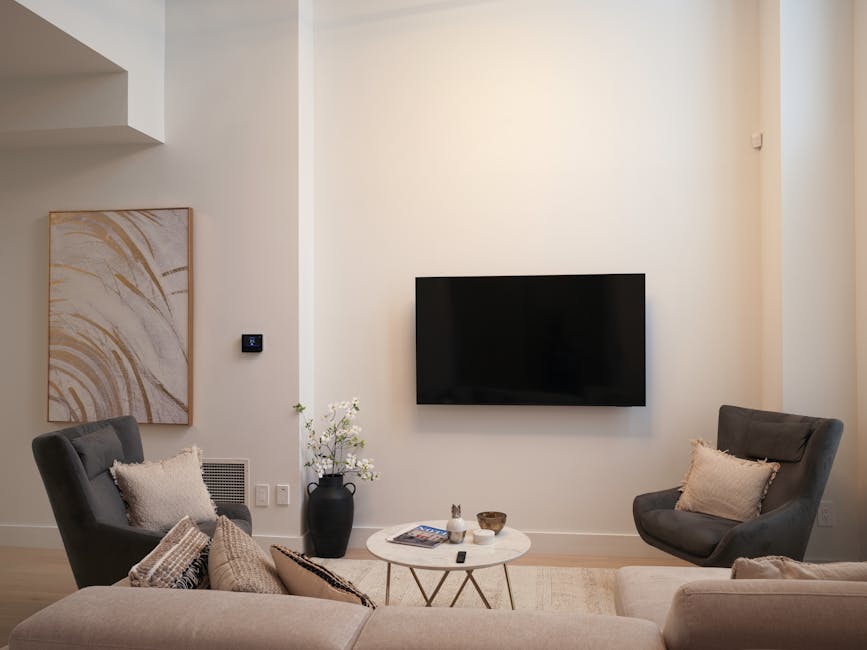 Cozy contemporary living room with neutral tones and minimalist decor.